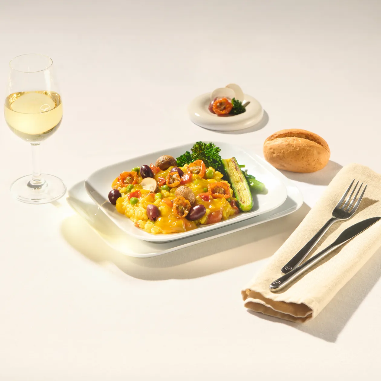 Vegetarian paella with zucchinis, mushrooms, broccoli and olives